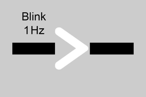 Hvit åpen trekant mellom to sorte linjer med teksten Blink 1 Hz over