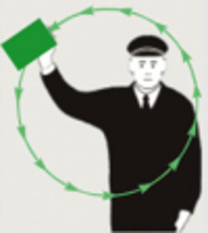 Person i uniform med grønt flagg, grønne piler i sirkel foran